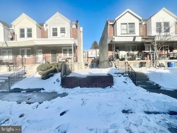 a view of a white house with wooden walls and floor