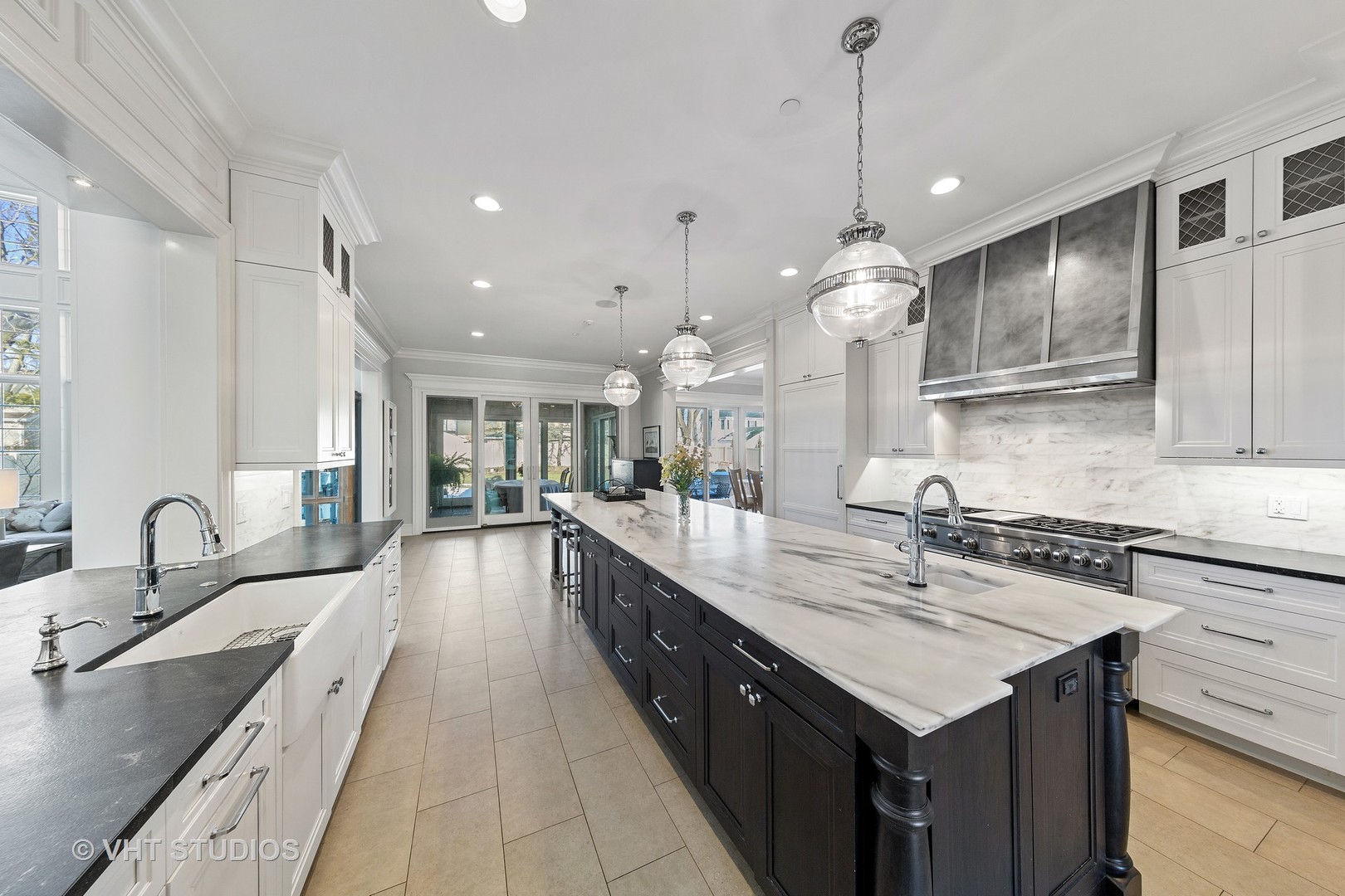2144 Woodlawn Road Northbrook, IL 60062 - Photo 11 of 45 a large kitchen with kitchen island a sink stainless steel appliances and a counter top