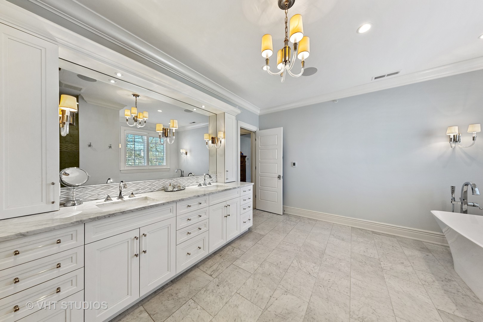 2144 Woodlawn Road Northbrook, IL 60062 - Photo 29 of 45 a bathroom with a granite countertop double vanity sink a mirror and shower