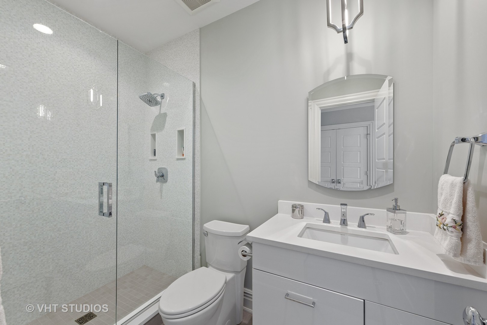 2144 Woodlawn Road Northbrook, IL 60062 - Photo 34 of 45 a bathroom with a granite countertop sink toilet and shower