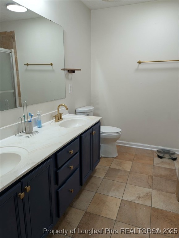 45 Copper Loop Sanford, NC 27332 - Photo 13 of 30 a bathroom with a sink a toilet and a mirror