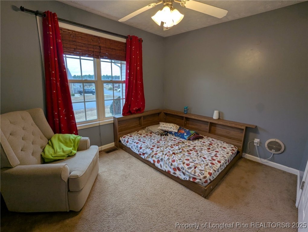 45 Copper Loop Sanford, NC 27332 - Photo 18 of 30 a living room with furniture and a rug