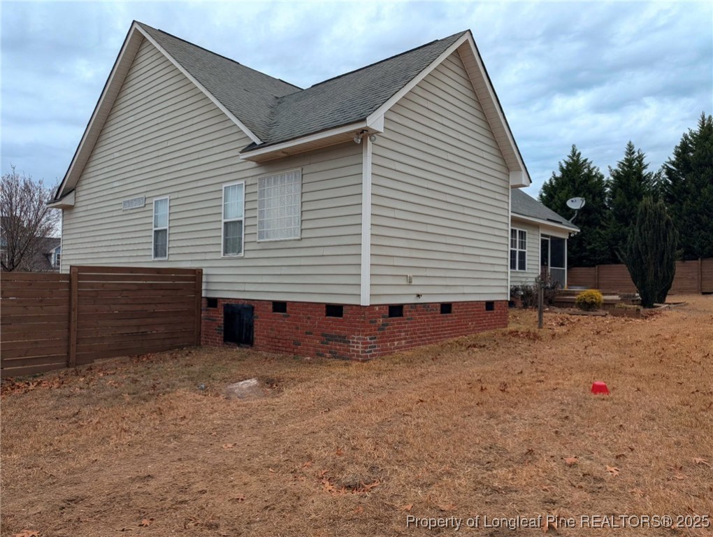 45 Copper Loop Sanford, NC 27332 - Photo 30 of 30 a view of a house with a yard and garage