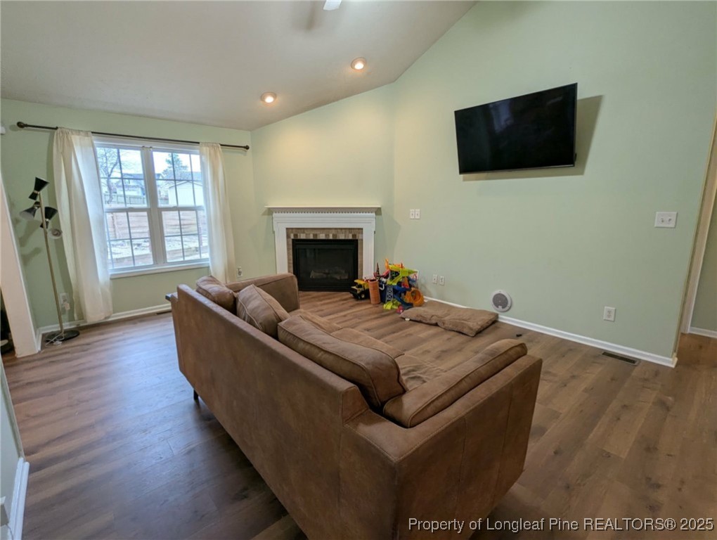 45 Copper Loop Sanford, NC 27332 - Photo 4 of 30 a living room with furniture and a flat screen tv