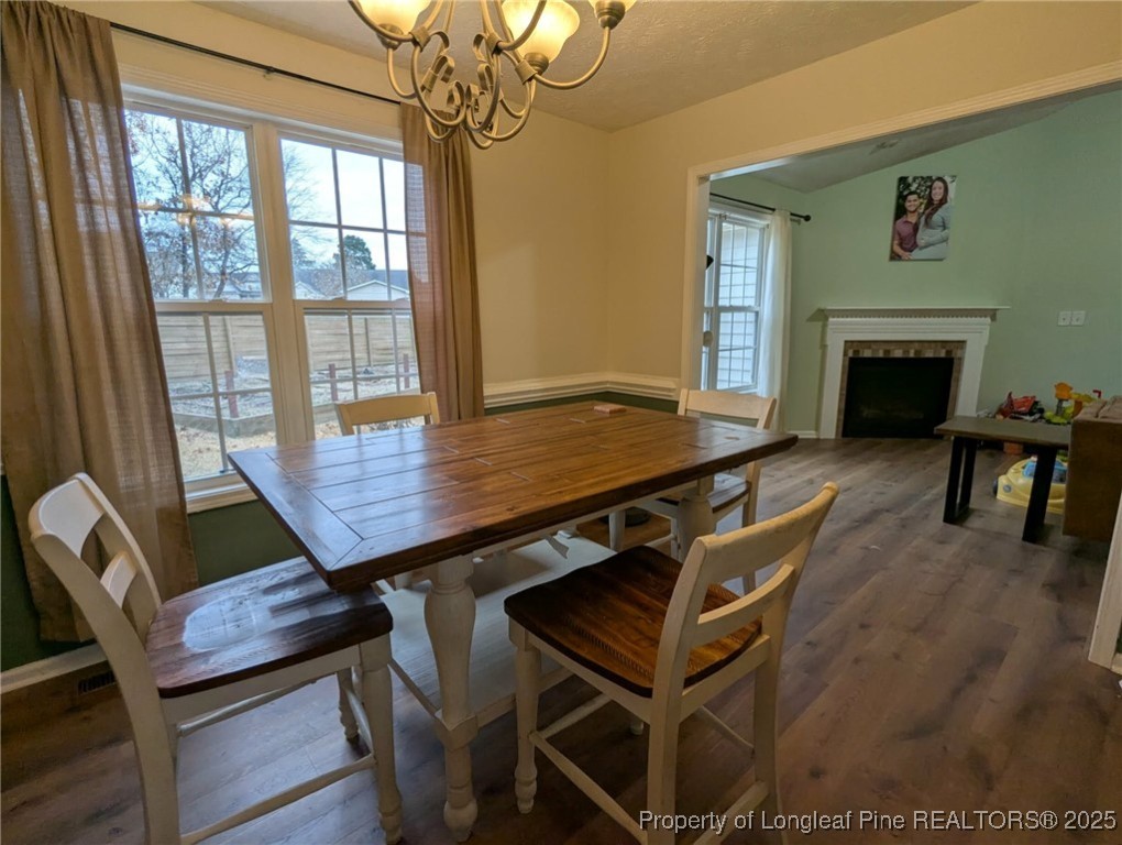 45 Copper Loop Sanford, NC 27332 - Photo 9 of 30 a view of a dining room with furniture window and wooden floor