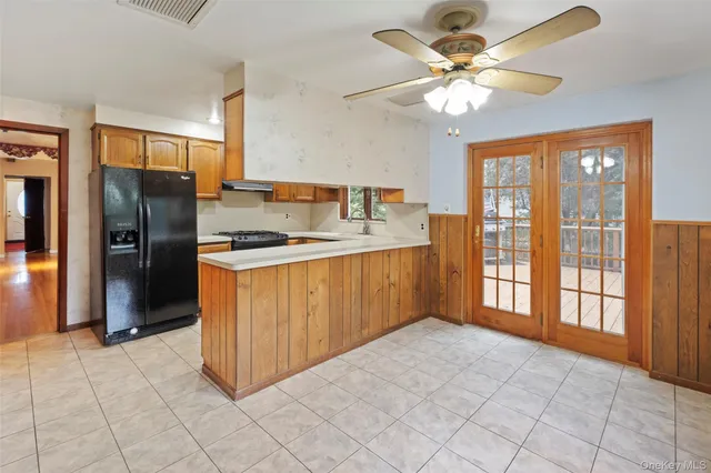 a kitchen that has a sink and a stove in it