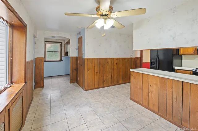 a bathroom with a granite countertop sink toilet tub and shower
