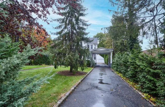 a view of a hallway with wooden floor and a house