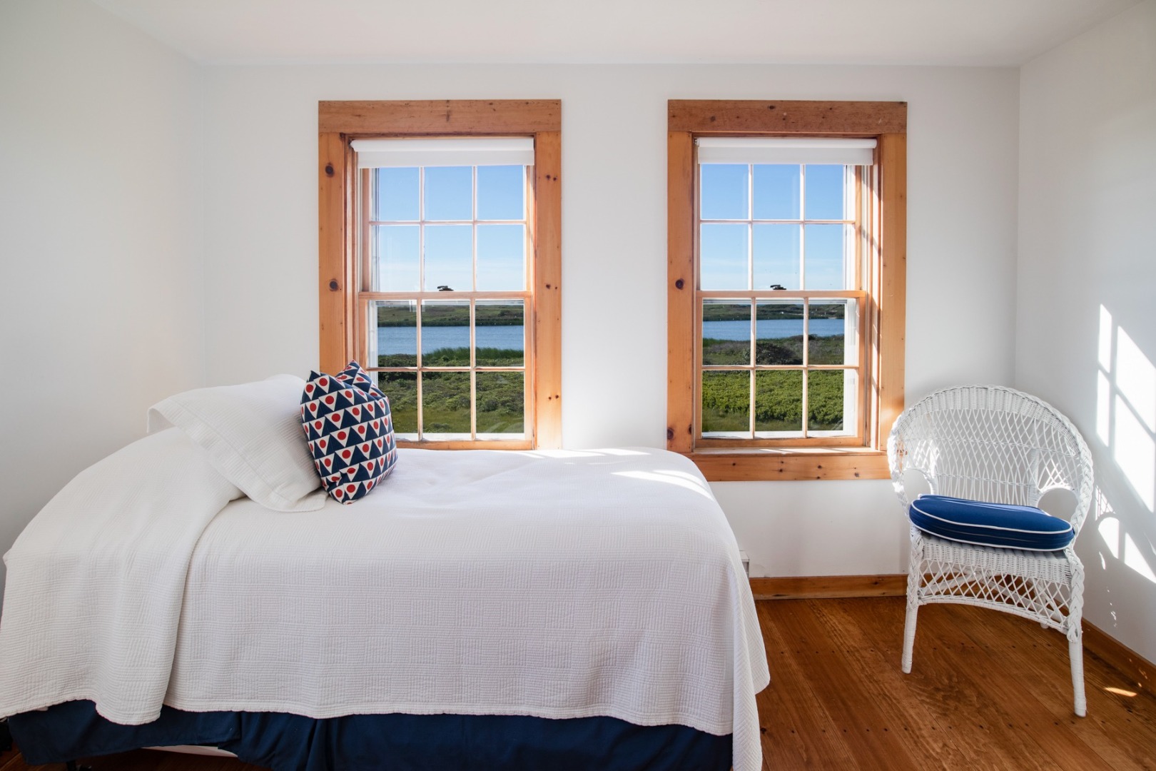 41 West Miacomet Road Nantucket, MA 02554 - Photo 17 of 23 a bedroom with a bed a table and chair