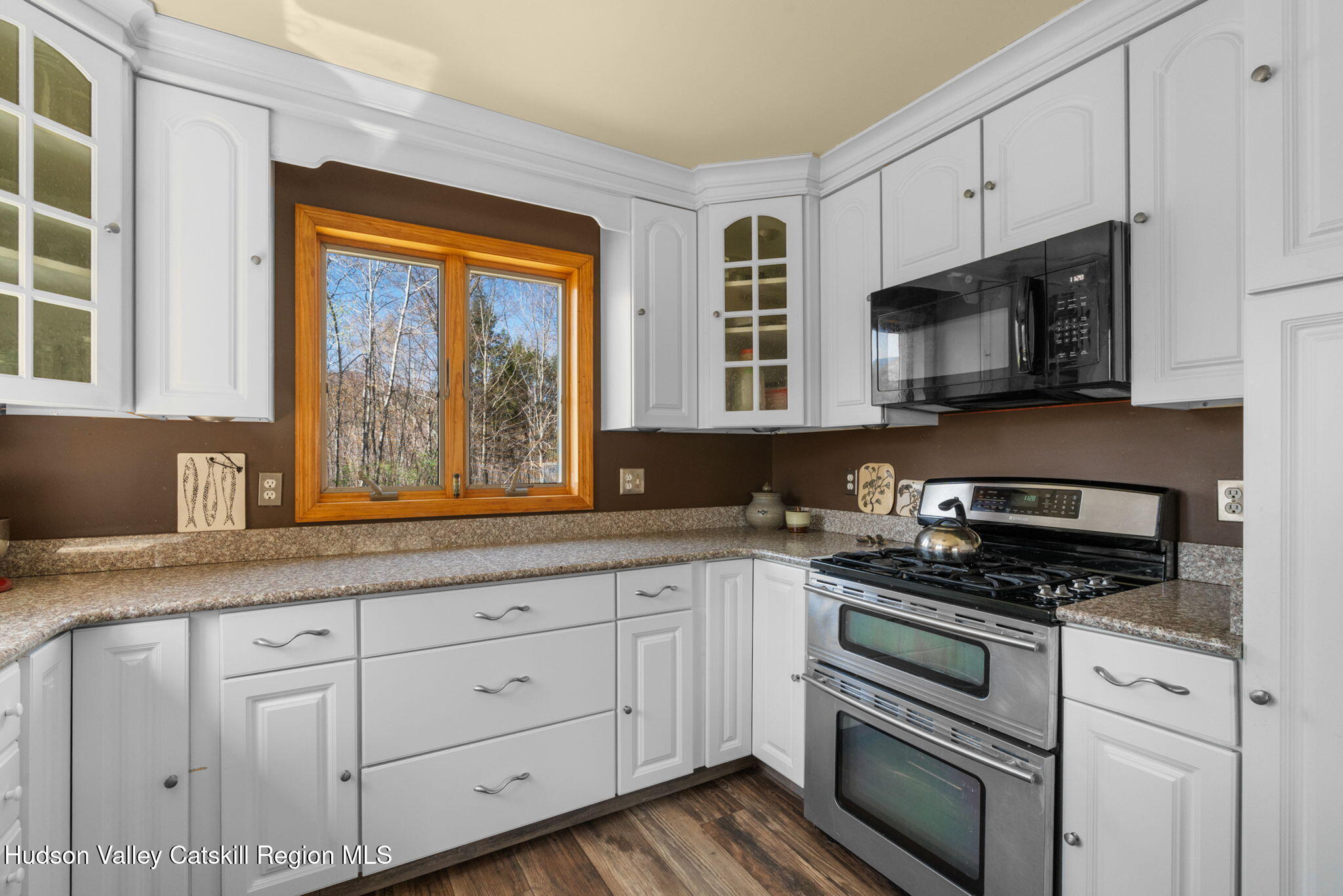 285 County Road 20 Cairo, NY 12413 - Photo 12 of 50 a kitchen with granite countertop white cabinets stainless steel appliances and a window