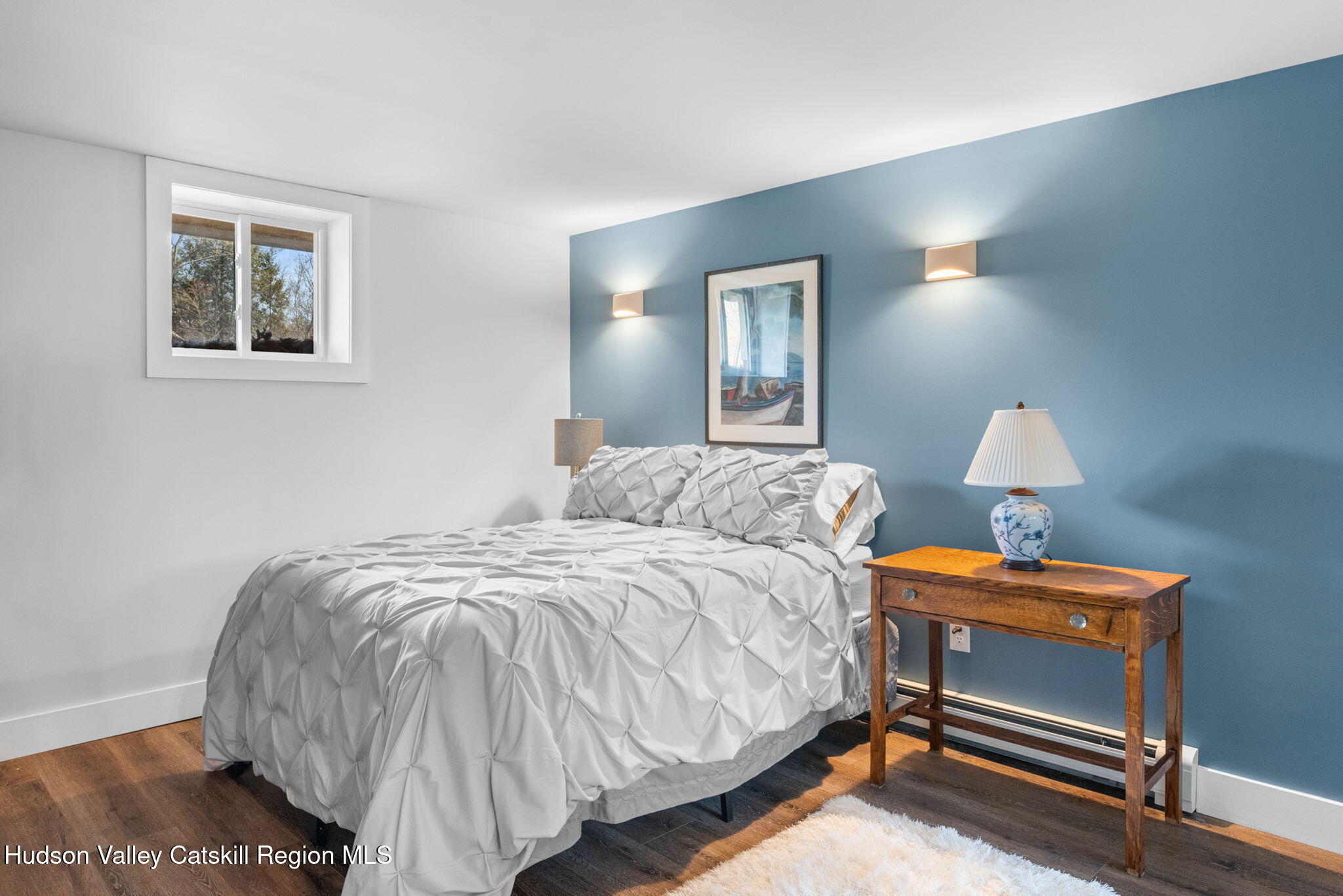 285 County Road 20 Cairo, NY 12413 - Photo 26 of 50 a bedroom with a bed and a lamp on dresser