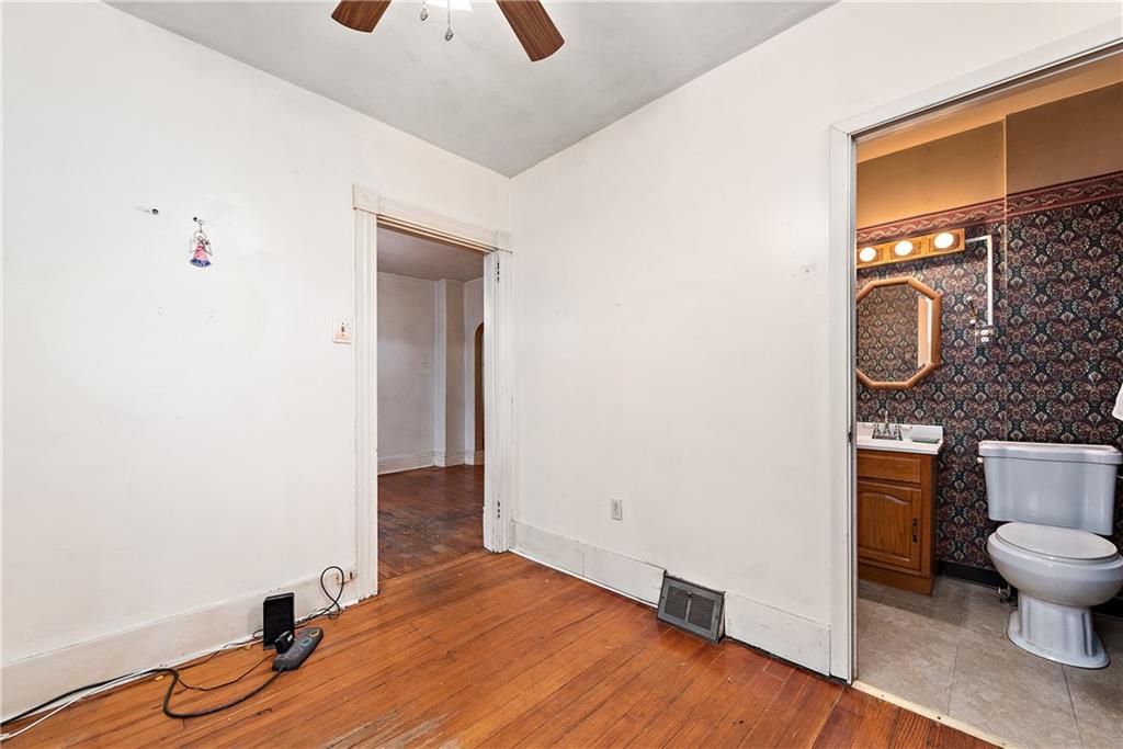 801 Frank Street McKees Rocks, PA 15136 - Photo 13 of 25 a bathroom with a toilet and a sink