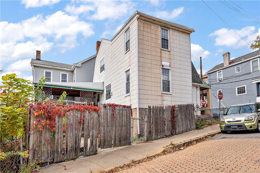 801 Frank Street McKees Rocks, PA 15136 - Photo 25 of 25 a view of a house with a cars park in front of a house