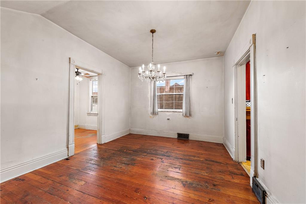 801 Frank Street McKees Rocks, PA 15136 - Photo 9 of 25 a view of an empty room with window and wooden floor