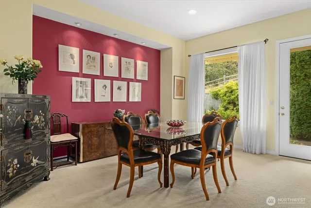 a view of a dining room with furniture and window
