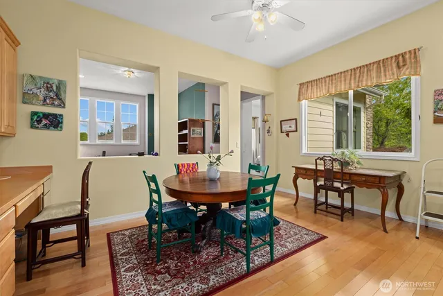 a view of a dining room with furniture window and wooden floor