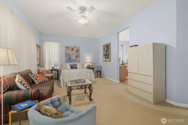 a living room with furniture and a chandelier
