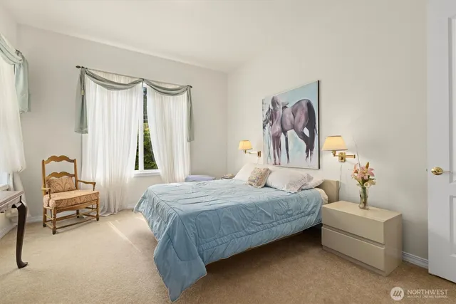 a bedroom with a bed and a couch