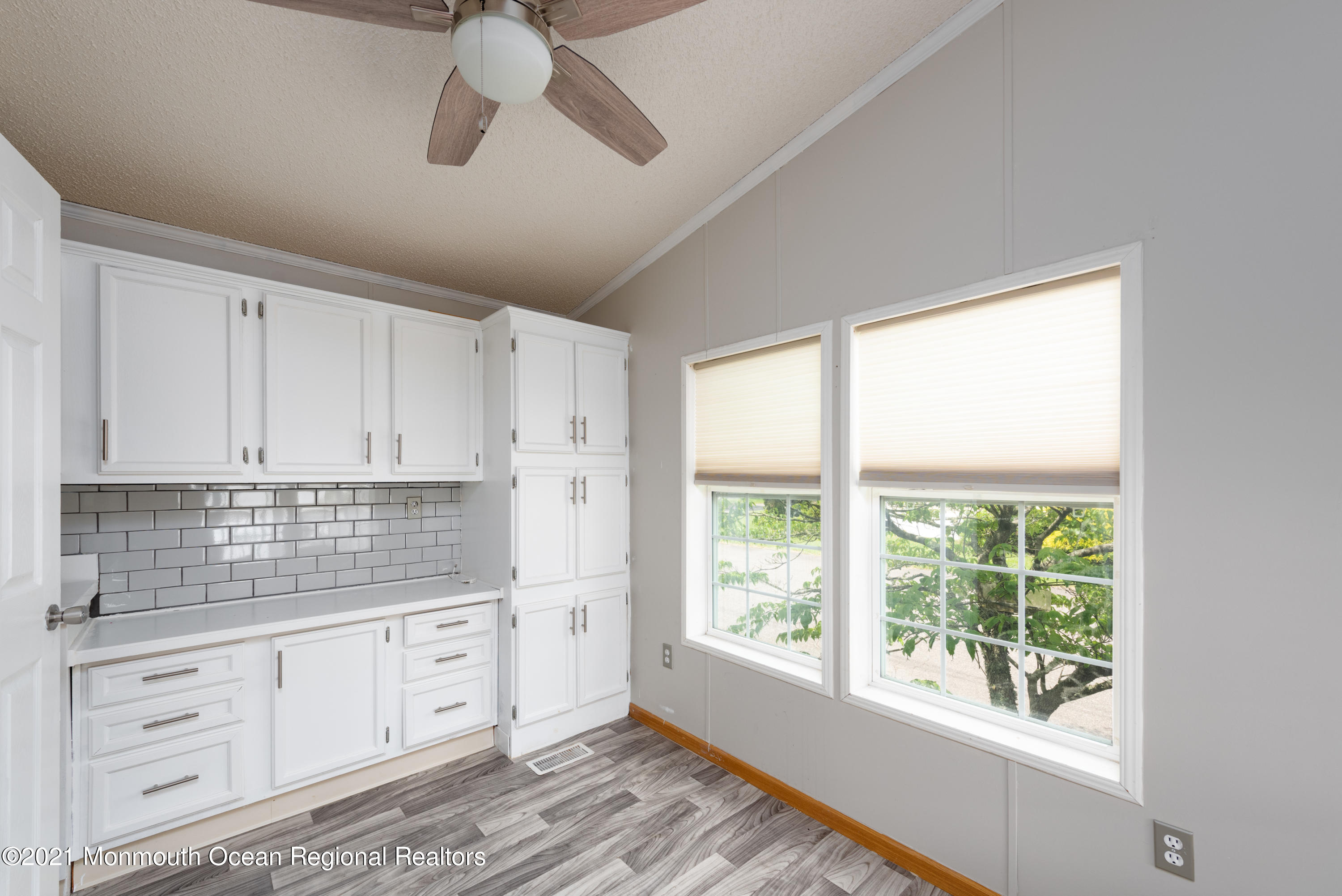 90 Village Road Morganville, NJ 07751 - Photo 8 of 25 a kitchen with appliances cabinets and a large window