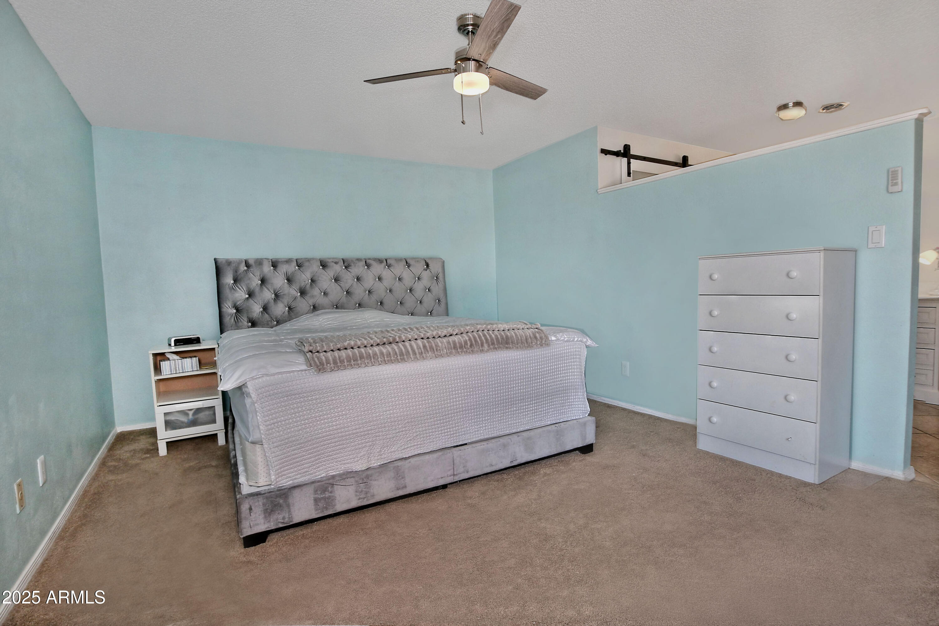 4301 East Sacaton Street Phoenix, AZ 85044 - Photo 11 of 17 a bedroom with a bed and a ceiling fan