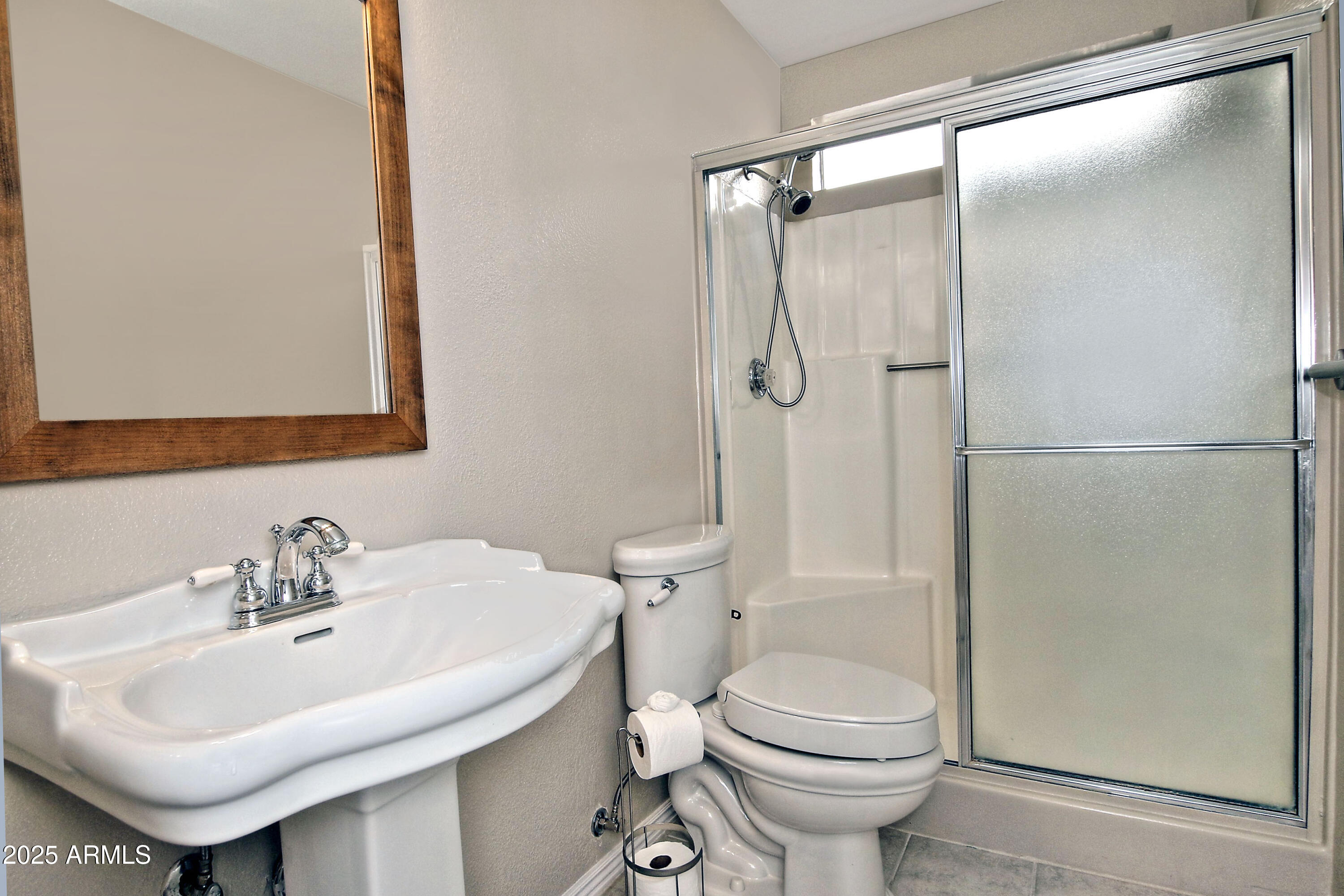 4301 East Sacaton Street Phoenix, AZ 85044 - Photo 15 of 17 a bathroom with a sink toilet and shower