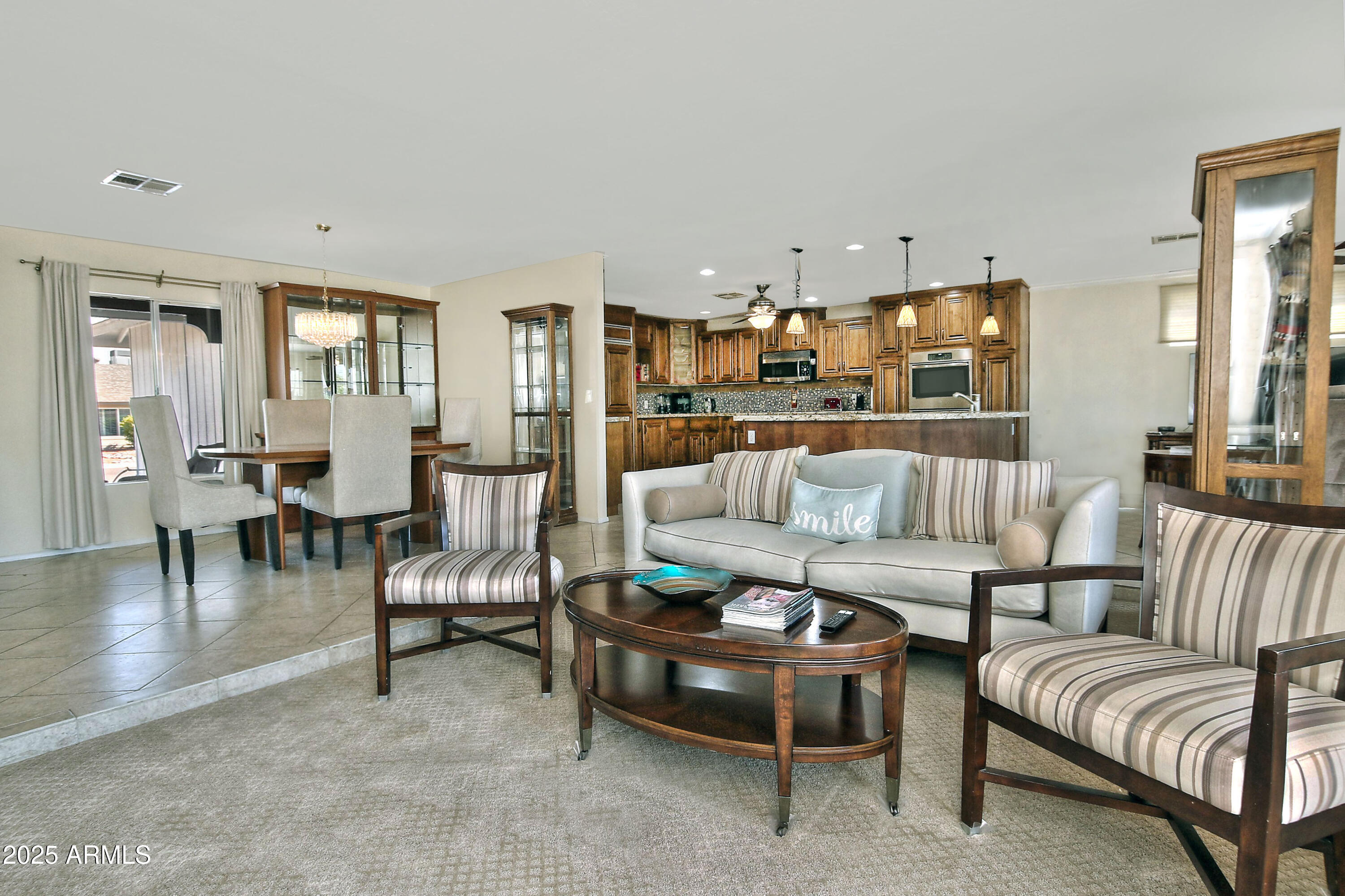 4301 East Sacaton Street Phoenix, AZ 85044 - Photo 5 of 17 a living room with furniture and kitchen view