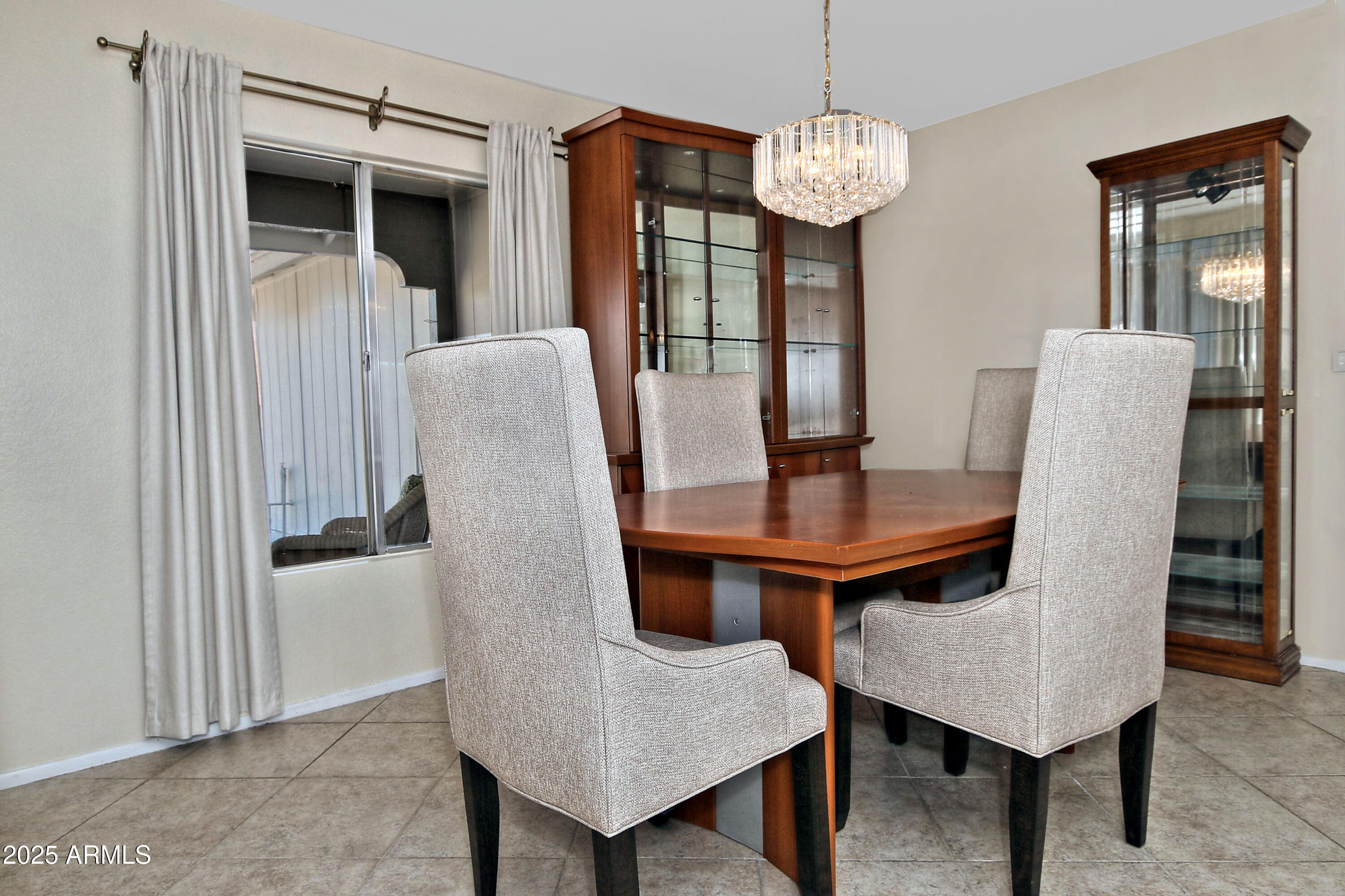 4301 East Sacaton Street Phoenix, AZ 85044 - Photo 6 of 17 a view of a dining room with furniture and wooden floor