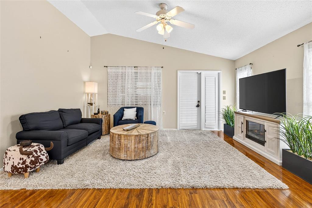 4658 Wallingford Court New Port Richey, FL 34655 - Photo 7 of 48 a living room with furniture and a flat screen tv