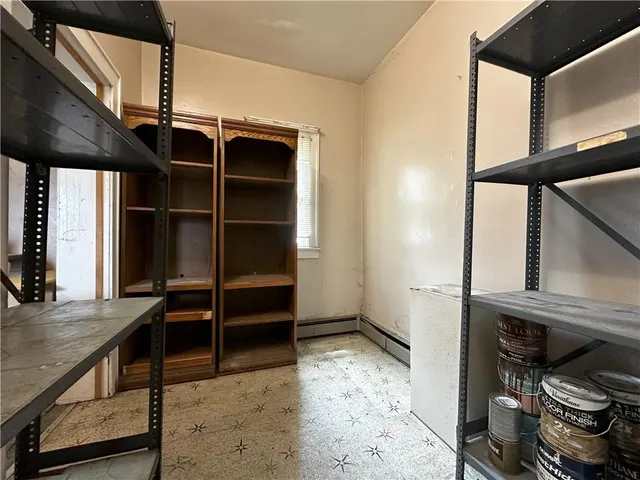 a bathroom with a bathtub and next to a window