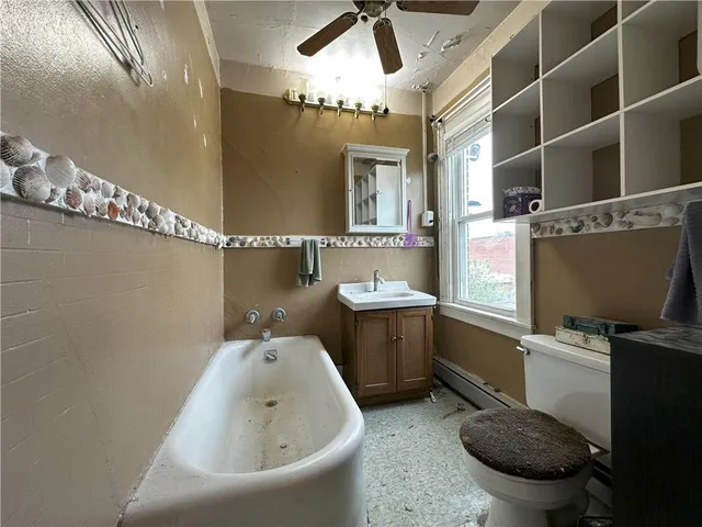 a view of a room with wooden floor and window