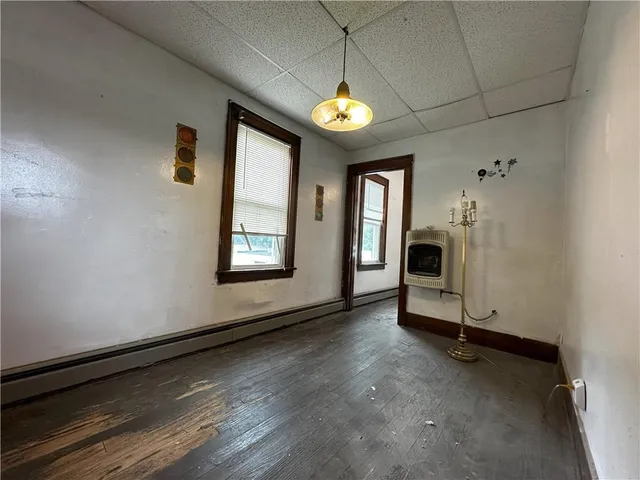 a view of an empty room with a fireplace