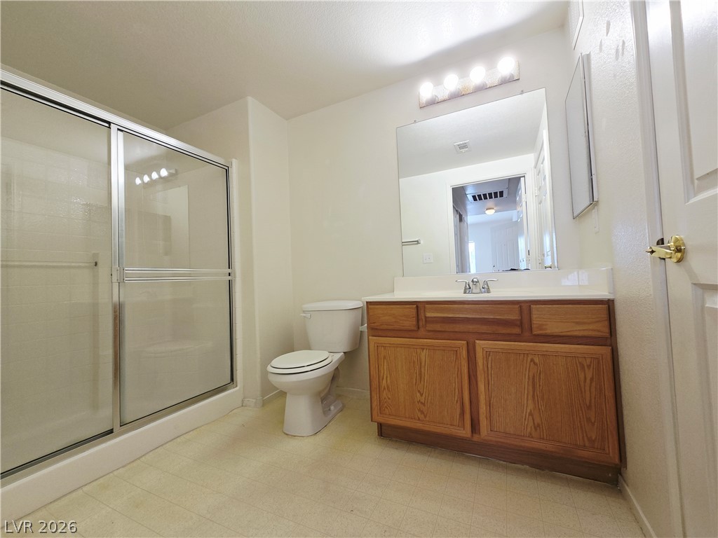 9580 West Reno Avenue, Unit 283 Las Vegas, NV 89148 - Photo 15 of 19 Bathroom with vanity, a stall shower, and light floors