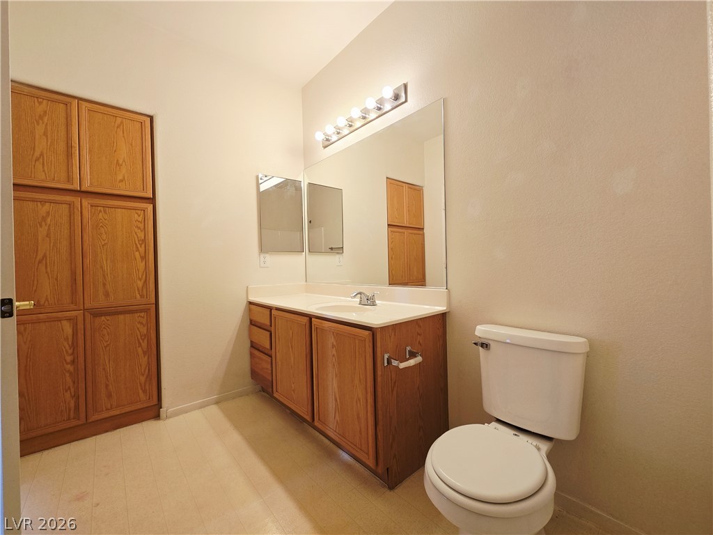 9580 West Reno Avenue, Unit 283 Las Vegas, NV 89148 - Photo 10 of 19 Bathroom with vanity, light flooring, and a closet