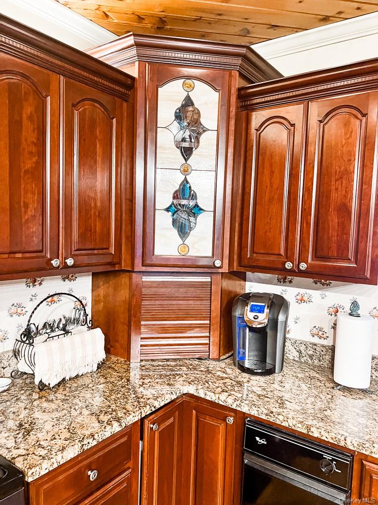 100 Old Tacy Road, Unit TR95 Bethel, NY 12783 - Photo 14 of 50 Kitchen with light stone counters and crown molding
