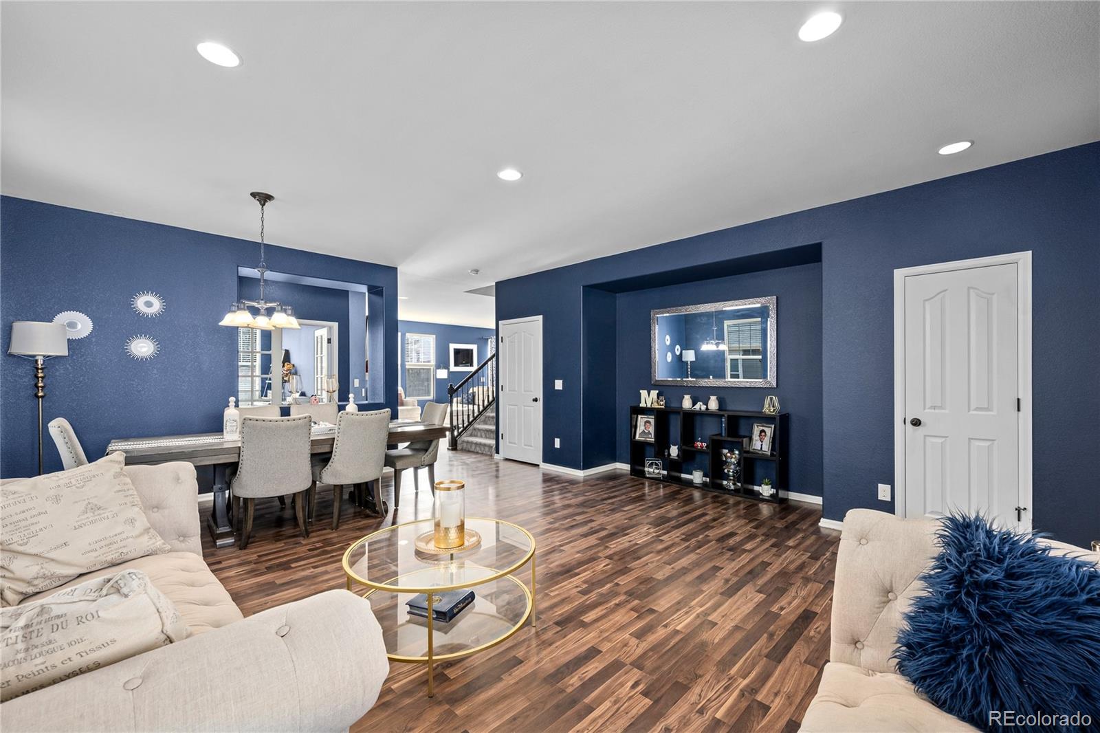 13826 West Layton Circle Morrison, CO 80465 - Photo 2 of 43 a living room with furniture and wooden floor