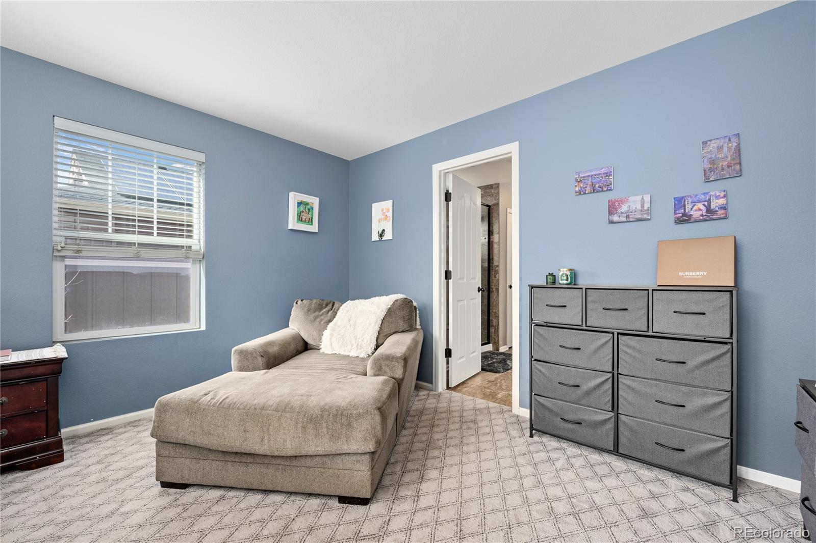 13826 West Layton Circle Morrison, CO 80465 - Photo 26 of 43 a bedroom with a bed and a window