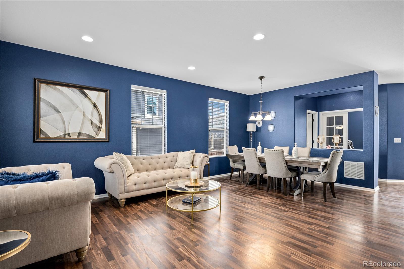 13826 West Layton Circle Morrison, CO 80465 - Photo 3 of 43 a living room with furniture and wooden floor