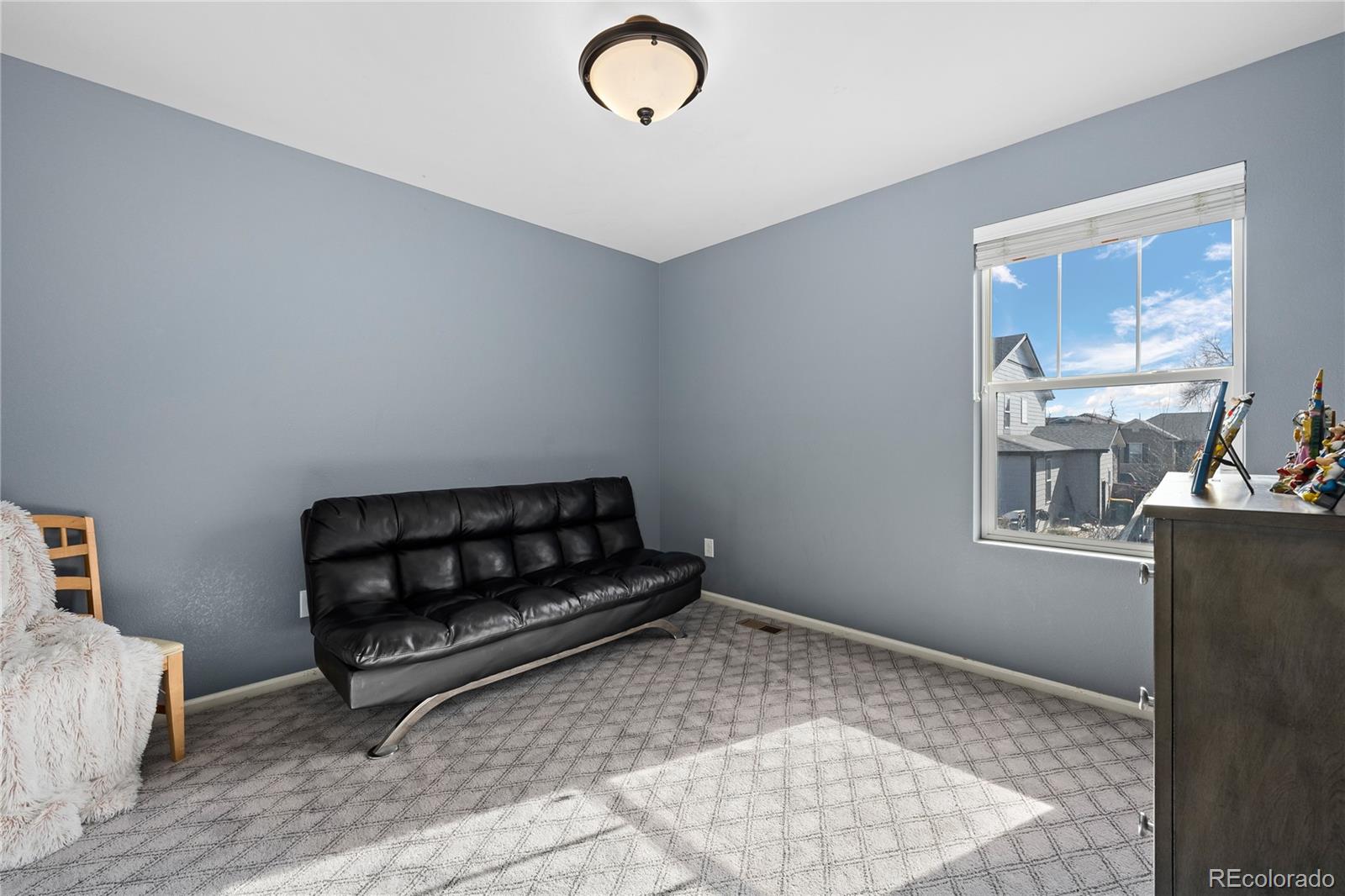 13826 West Layton Circle Morrison, CO 80465 - Photo 33 of 43 a living room with a couch