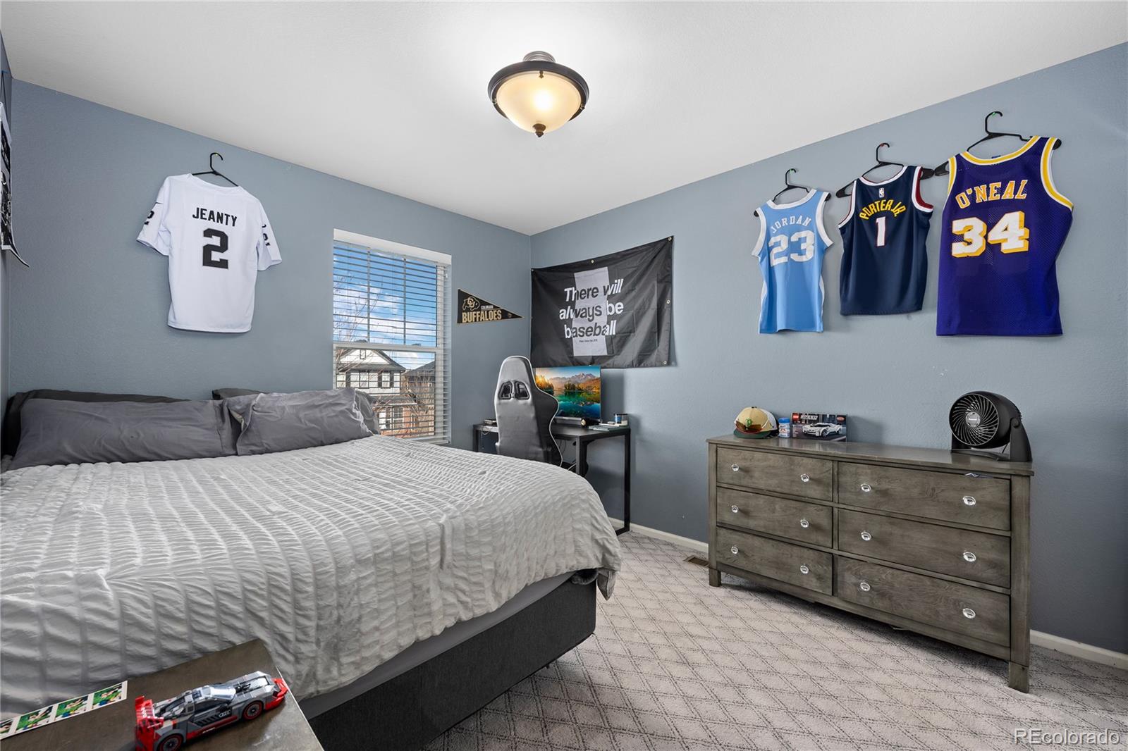 13826 West Layton Circle Morrison, CO 80465 - Photo 34 of 43 a bedroom with a bed and dresser