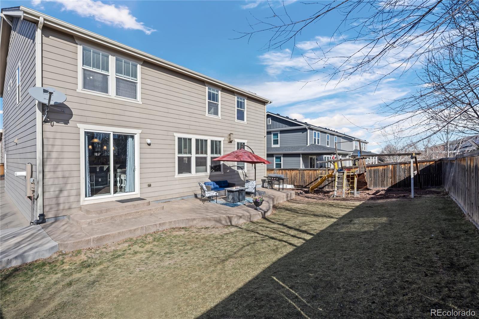13826 West Layton Circle Morrison, CO 80465 - Photo 39 of 43 a front view of a house with patio