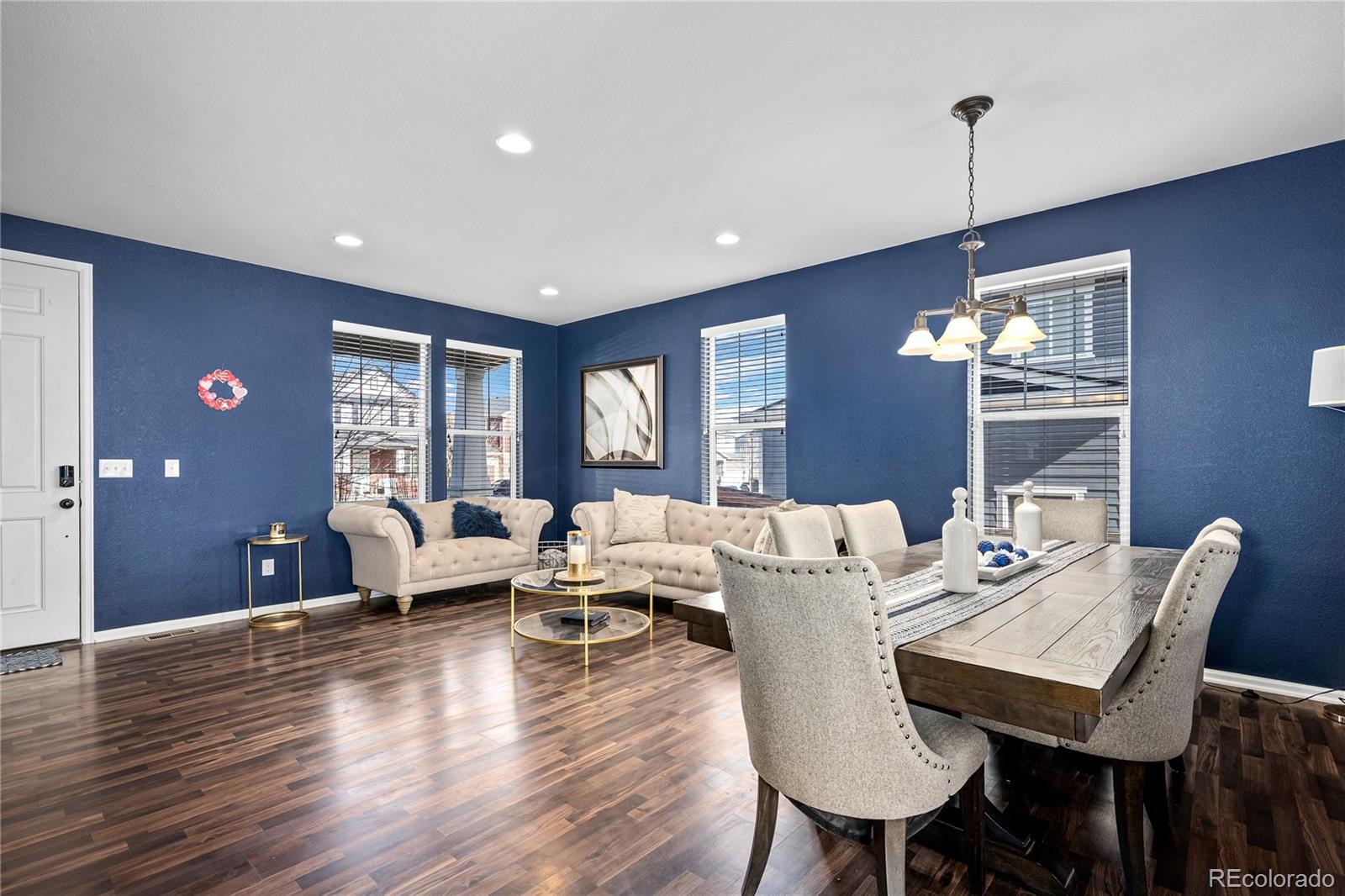 13826 West Layton Circle Morrison, CO 80465 - Photo 4 of 43 a living room with furniture two window and wooden floor