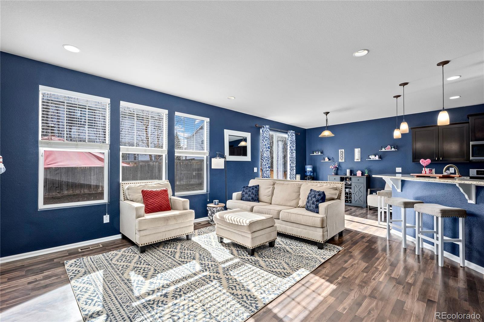 13826 West Layton Circle Morrison, CO 80465 - Photo 6 of 43 a living room with furniture and a flat screen tv