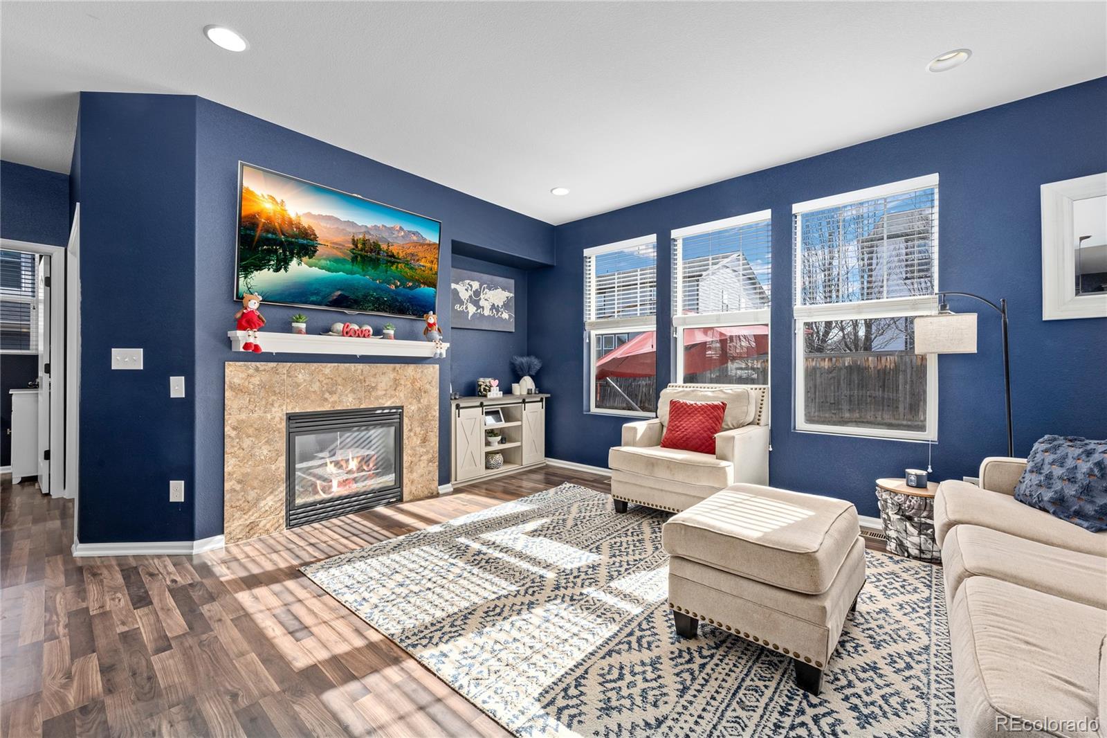 13826 West Layton Circle Morrison, CO 80465 - Photo 7 of 43 a living room with furniture and a fireplace