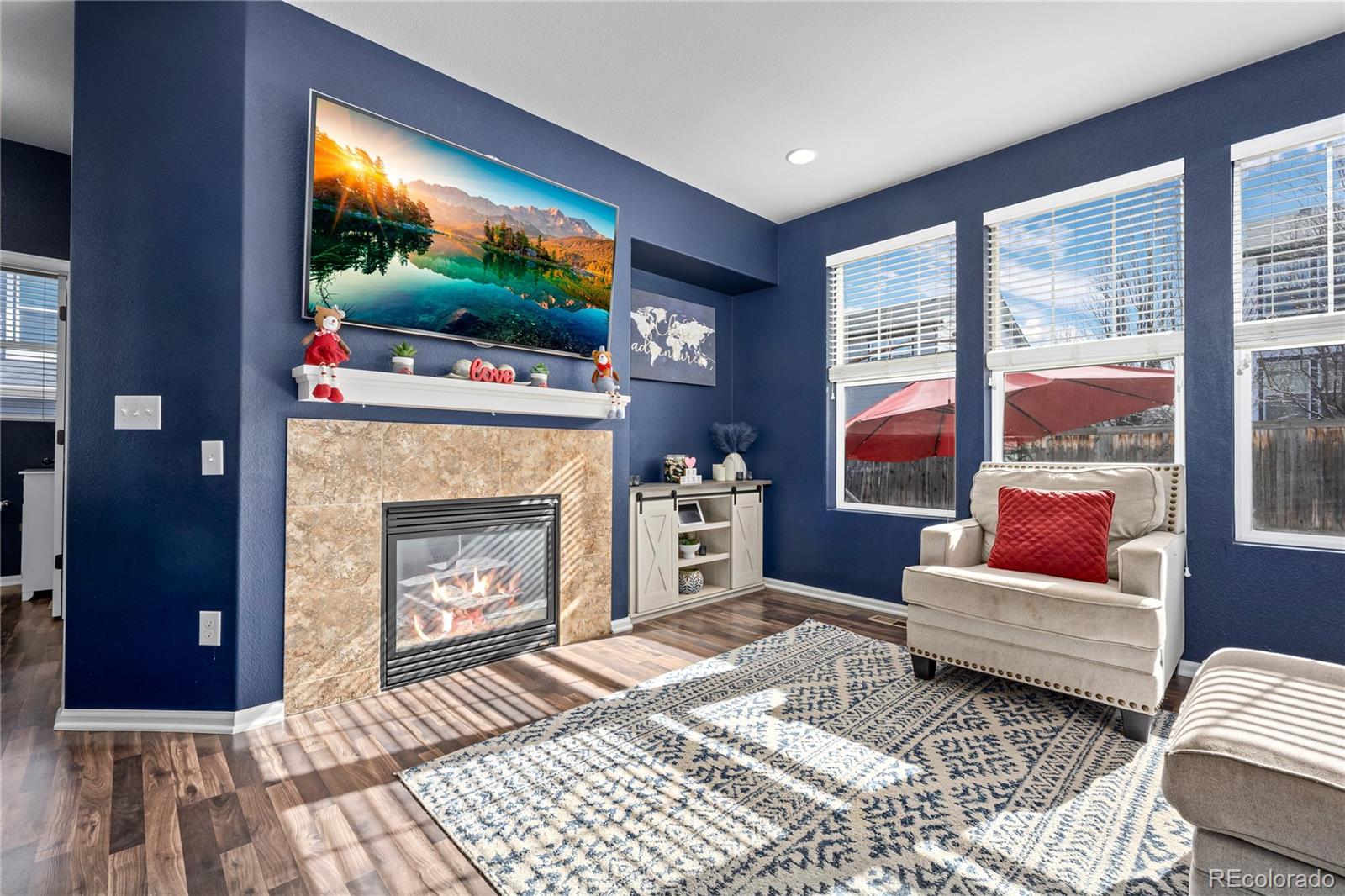 13826 West Layton Circle Morrison, CO 80465 - Photo 9 of 43 a living room with furniture and a flat screen tv
