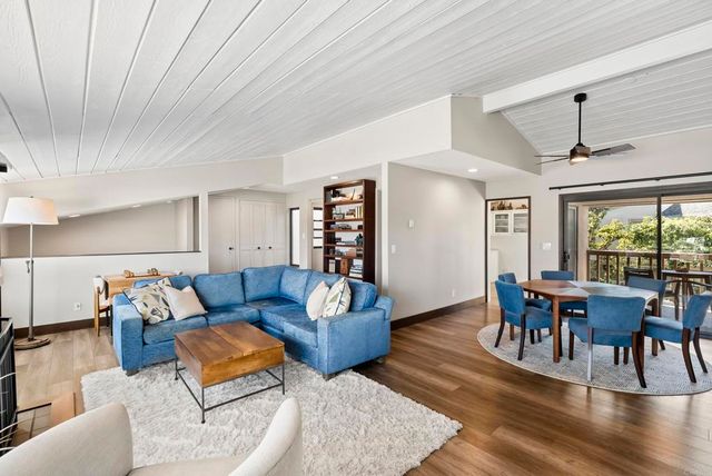 a view of a balcony furniture and wooden floor