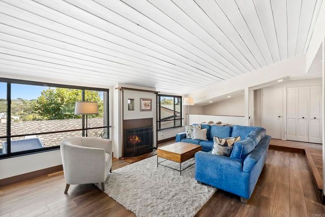 a kitchen with stainless steel appliances granite countertop a stove and a sink with large window