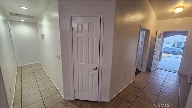 a view of a livingroom with a ceiling fan and window