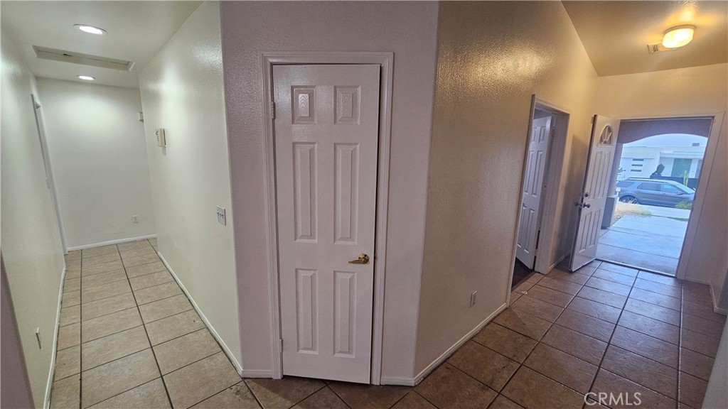 16528 Avenida Mirola Desert Hot Springs, CA 92240 - Photo 4 of 9 a view of a hallway with entryway door