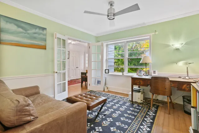 a bedroom with a bed and a table