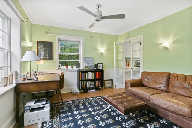 a living room with furniture and a rug